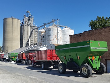 Grain Elevator and Waiting Grain Trucks